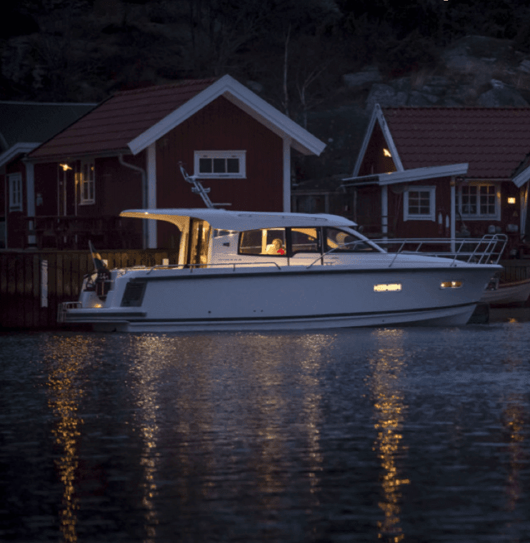 Nimbus boat in the harbour at night